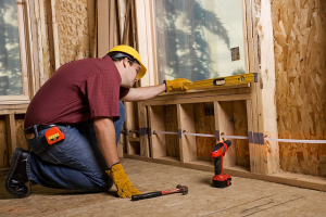 residential plumber pulling a pipe